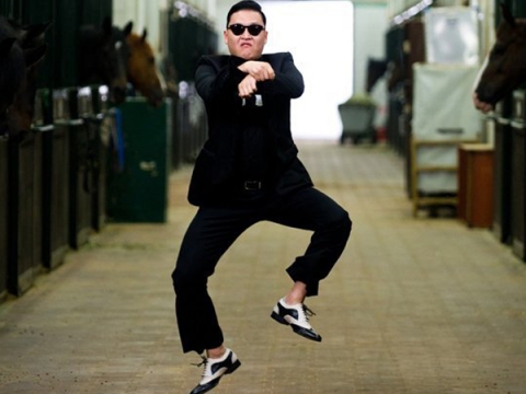 PSY doing the Gangnam Style horse dance inside a stable